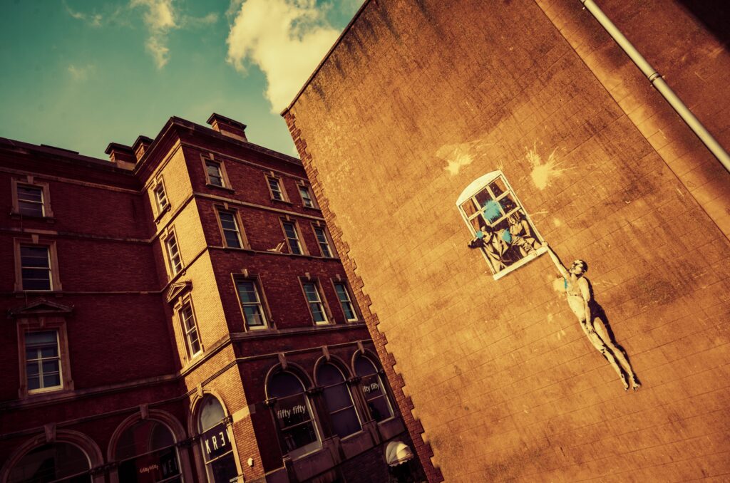 Bristol, United Kingdom - 3th May 2014: Buildings at Park Street displaying the famous Bansky's graffiti "Naked Man".